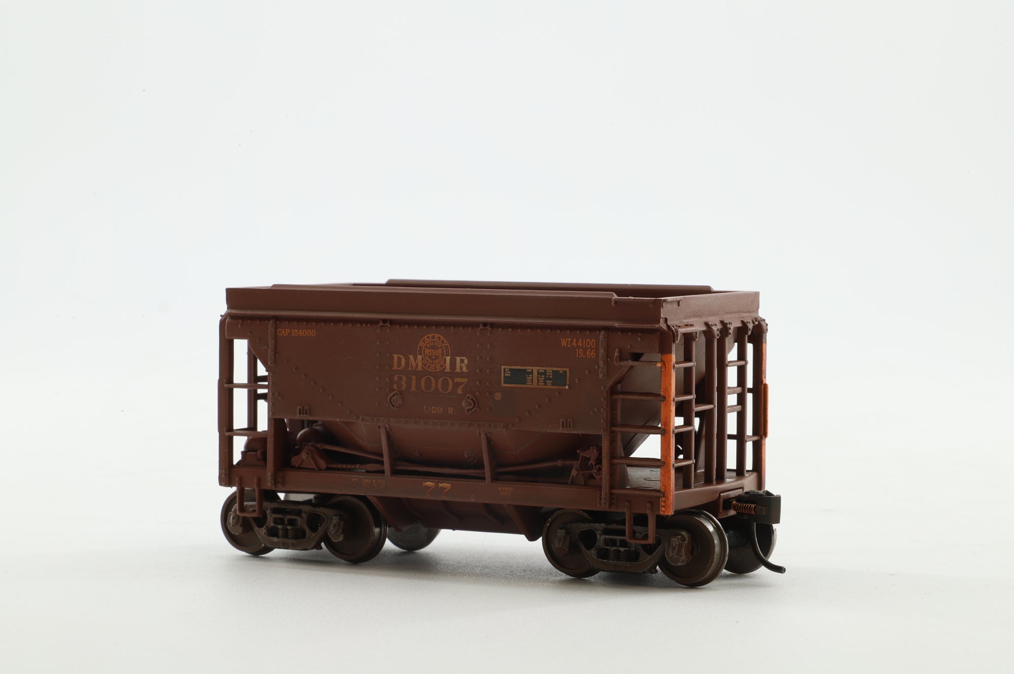 Walthers HO 4-Pack of 24' Michigan Ore Cars in DMIR Brown/Yellow - Pro-Weathered/Renumbered