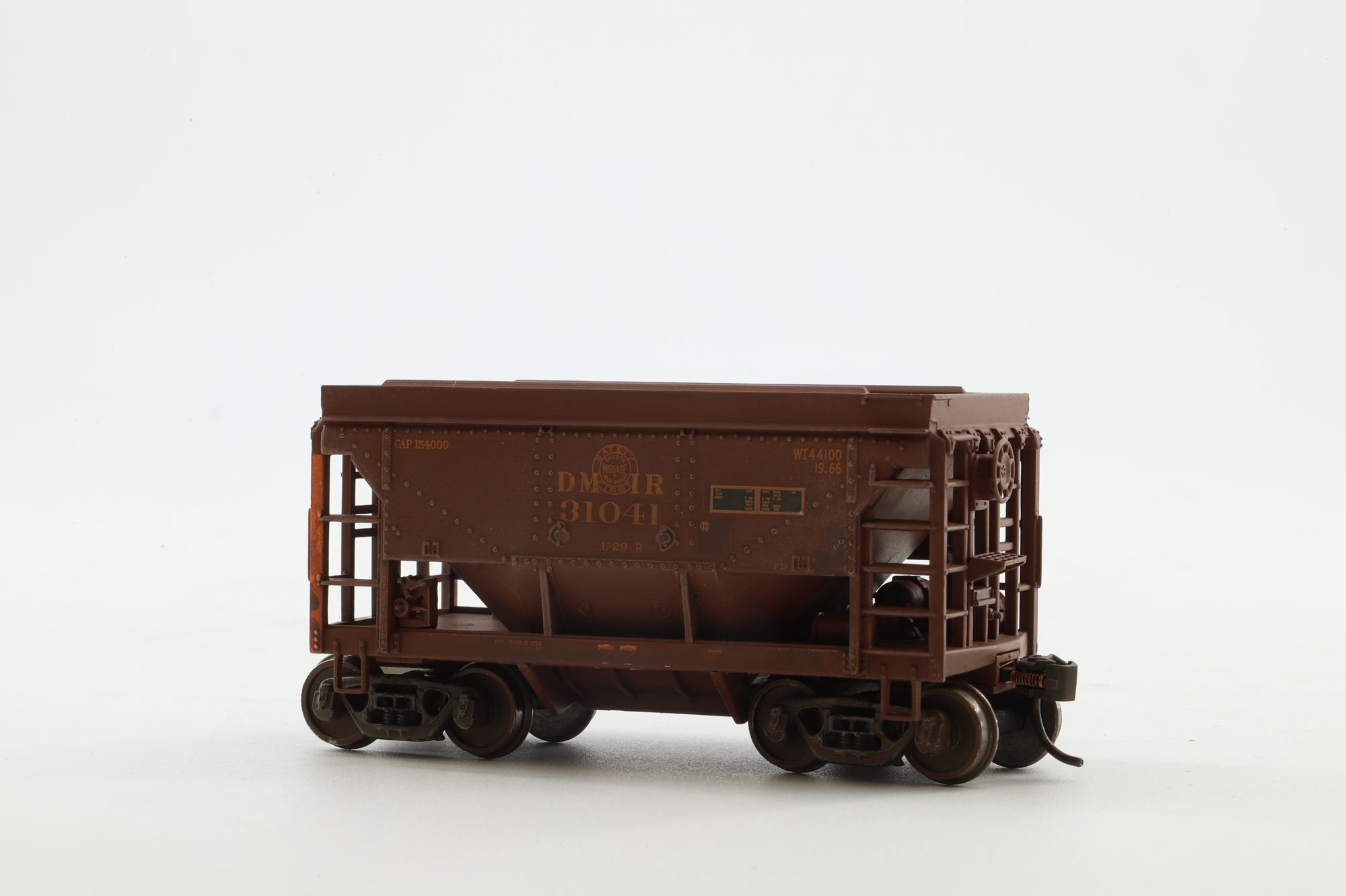 Walthers HO 4-Pack of 24' Michigan Ore Cars in DMIR Brown/Yellow - Pro-Weathered/Renumbered