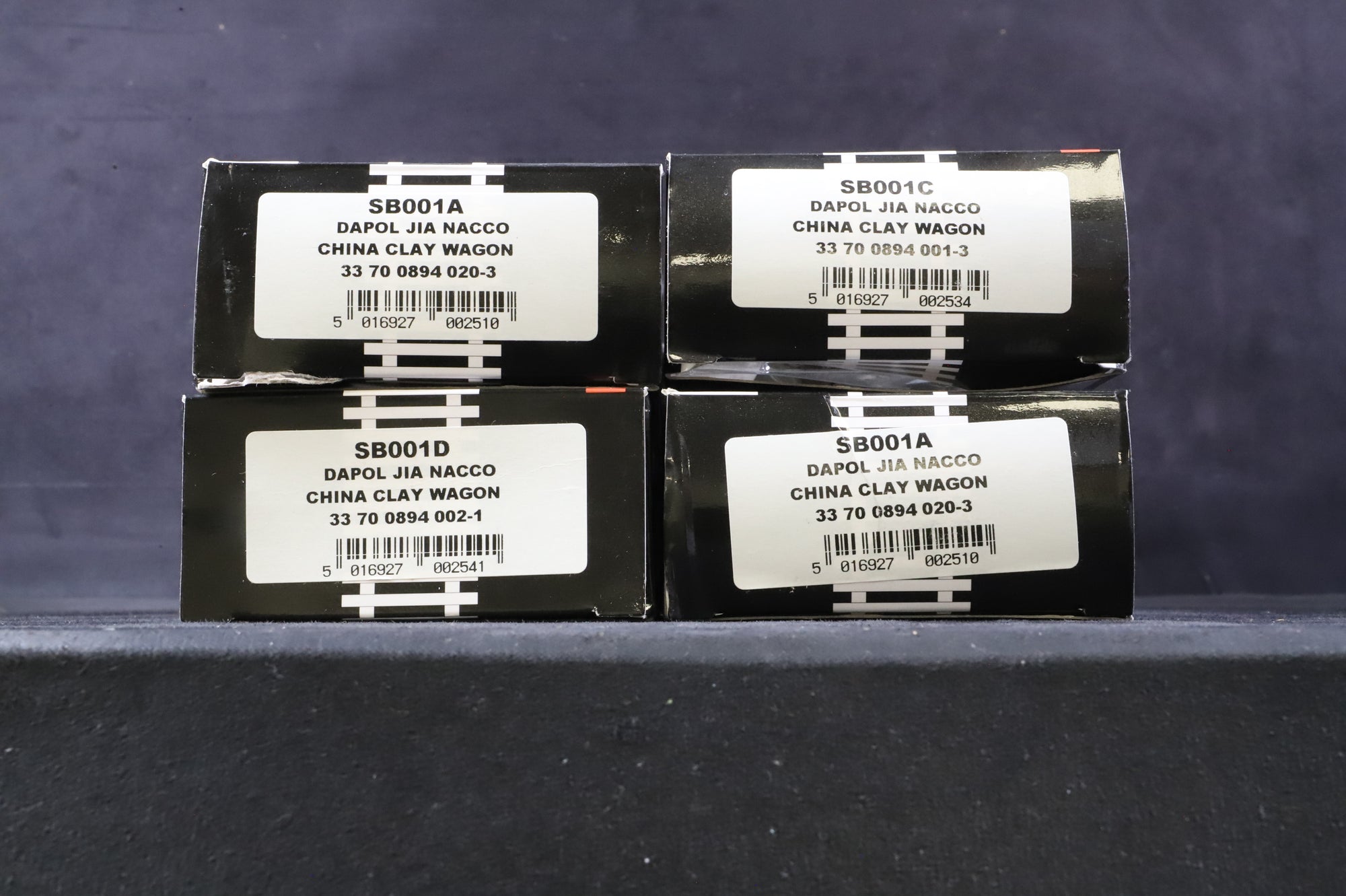 KMRC/Dapol OO Rake of 4 JIA Wagons in Nacco/Imerys Livery - Weathered